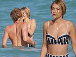 Gigi Hadid and Cody Simpson take a swim in the ocean in Miami Beach, FL. Gigi wore a retro striped bikini as relaxed on the beach with boyfriend Cody.\n\nPictured: Gigi Hadid and Cody Simpson\nRef: SPL976260  150315  \nPicture by: Pichichi / Splash News\n\nSplash News and Pictures\nLos Angeles: 310-821-2666\nNew York: 212-619-2666\nLondon: 870-934-2666\nphotodesk@splashnews.com\n