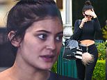 UK CLIENTS MUST CREDIT: AKM-GSI ONLY
EXCLUSIVE: Calabasas, CA - A fresh faced Kylie Jenner was seen wearing what appears to be an engagement ring while shopping at Sephora in Calabasas. The reality star covered her makeup free face with her left hand revealing a gold ring with a large diamond, could Kylie be the next Kardashian to wed?

Pictured: Kylie Jenner
Ref: SPL979591  180315   EXCLUSIVE
Picture by: AKM-GSI / Splash News