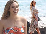 Elizabeth Olsen got busy for the camera on Malibu beach.  The actress was hard at work, shooting her latest project, on Friday,  March 20, 2015 X17online.com