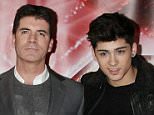 Simon Cowell with One Direction (from left) Liam Payne, Louis Tomlinson, Harry Styles, Zayn Malik and Niall Horan attending a press conference for X Factor, at The Connaught Hotel in central London. PRESS ASSOCIATION Photo. Picture date: Thursday December 9, 2010. Photo credit should read: Yui Mok/PA Wire