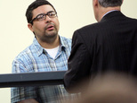 Carlos Colina, left, speaks with his attorney John Cunha, Jr., right, during his arraignment in Cambridge District Court in Medford, Mass., Monday, April 6, 2015.  Colina was charged with being an accessory after the crime of assault and battery causing serious bodily injury and the improper disposal of human remains, after the discovery of human remains in Cambridge on Saturday. (AP Photo/The Boston Herald, Chitose Suzuki, Pool)