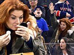 NEW YORK, NY - APRIL 04:  Daniel Zelman, Roman Zelman and Debra Messing attend New Jersey Devils vs New York Rangers game at Madison Square Garden on April 4, 2015 in New York City.  (Photo by James Devaney/GC Images)