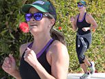 Picture Shows: Reese Witherspoon  April 06, 2015\n \n 'Wild' star Reese Witherspoon goes for a jog with a friend before her morning yoga class in Brentwood, California.\n \n Reese recently shared the results of her hard work at the gym with a swimsuit picture she posted to Instagram last Friday. In the picture, Reese lounged in an inflatable pool donut (with sprinkles!) and captioned it "#DonutWorryBeHappy?!"\n \n Exclusive - All Round\n UK RIGHTS ONLY\n \n Pictures by : FameFlynet UK © 2015\n Tel : +44 (0)20 3551 5049\n Email : info@fameflynet.uk.com