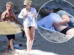 PREMIUM EXCLUSIVE - Sean Penn and girlfriend Charlize Theron took a trip down to Malibu beach for a bit of sun and surfing.  Sean got int the water with his board, while Charlize stayed on beach in her black bikini, on Sunday, April 12, 2015 X17online.com\nNO WEB SITE USAGE.\nNO PAPER USAGE\nNO MAGAZINE USAGE\nAny quieries please call Alasdair or Gary on office 0034 966 713 949/926 or mibile Gary 0034 686 421 720 or Alasdair on 0034 630 576 519