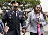 John Jackson, left, and his wife Carolyn Jackson, of Mount Holly, N.J., walk out of Martin Luther King, Jr. Courthouse, Thursday, May 9, 2013, in Newark, N.J. The U.S. Army major and his wife pleaded not guilty to abusing their foster children. Each remains free on $250,000 bail, charged with endangerment, assault and conspiracy. The couple are accused of abusing their three foster children with disciplinary measures that included assault, withholding food and water, and forcing the children to eat hot sauce. (AP Photo/Julio Cortez)
