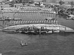 USS Oklahoma
WWII
File:NASPH ^118506- 19 March 1943. USS Oklahoma- Salvage. Aerial view toward shore with ship in 90 degree position. - NARA - 296975.jpg