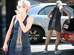 UK CLIENTS MUST CREDIT: AKM-GSI ONLY
EXCLUSIVE: Hollywood, CA - British singer Lily Allen, left little to the imagination when she wore a dress that exposed her Calvin Klein underwear front and back.  She was seen in the lace-up dress after she grabbed lunch at Canter's Deli.  Later, Lily was seen at the liquor store picking up 'Red Stripe' bear and  lime soda pop.

Pictured: Lily Allen
Ref: SPL1000654  150415   EXCLUSIVE
Picture by: AKM-GSI / Splash News