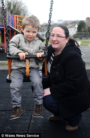 Nearly halfway there: Kyle (pictured his mother Samantha) needs £58,000 to have an operation in America