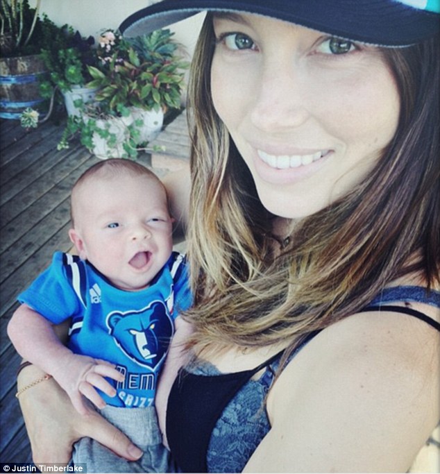 Welcome to the world: Justin Timberlake has shared the first photo of his baby son Silas, in the arms of Jessica Biel