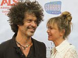 ***MANDATORY BYLINE TO READ INFPhoto.com ONLY***
Renee Zellwegger and her boyfriend Doyle Bramhall attend 'One Starry Night: From Broadway to Hollywood' gala benefiting the ALS Association Golden West Chapter in Los Angeles, CA.  Renee was attending to support her publicist Nanci Ryder who has been diagnosed with ALS.  Renee broke headlines back in October 2014, when an appearance prompted speculation that the actress had gotten plastic surgery.  The actress celebrates her 46th birthday on Saturday, April 25.

Pictured: Renee Zellweger, Doyle Bramhall
Ref: SPL1004890  200415  
Picture by: INFphoto.com