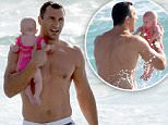 ***NO WEB USAGE BEFORE 9PM PST, TUESDAY APRIL 21, 2015.***\nEXCLUSIVE TO INF.\nApril 20 2015: Hayden Panettiere's fiancÈ and World Heavyweight Champion Wladimir Klitschko plays in the surf with his baby daughter Kaya in Miami Beach, FL.\nMandatory Credit: INFphoto.com Ref: infusmi-13