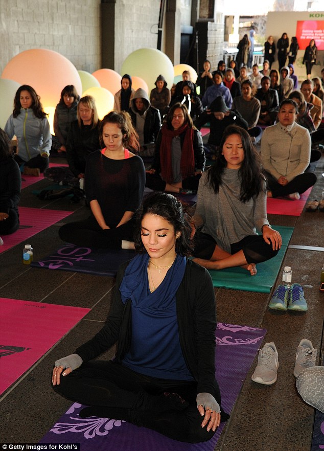 Leading the pack: She sat front and center inside the vibrant yoga studio with more than 100 yogis in attendance