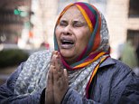 Halima Yusuf, a friend of the family of Hanad Mustafe Musse, one of the six young Somali-Americans accused of trying to sneak off to Syria to join terror organizations, cries for the boys outside the United States Courthouse in downtown St. Paul after hearings on Thursday, April 23, 2015. (Leila Navidi/Star Tribune via AP)