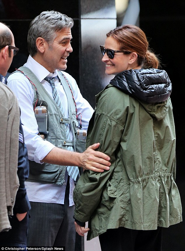 They play lovers, again: Robert and co-star George Clooney are lovebirds on Money Monster; they also played a couple in the Ocean's Eleven movies. Here they are filming on Saturday