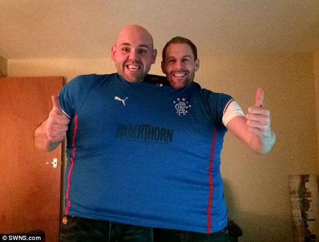 Shrunk: Mr Rush and a friend can both squeeze into his old XXXXXL Rangers football shirt