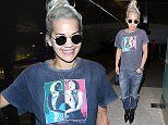 Rita Ora wore a Madonna Blonde Ambition tee with jeans for her flight into LAX.  The pop star wore her white hair up, with shades and a playboy bunny pendant, on Thursday, April 23, 2015 X17online.com