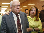Robert Bates, left, leaves his arraignment with his daughter, Leslie McCreary, right, in Tulsa, Okla., Tuesday, April 21, 2015.  Bates, a 73-year-old Tulsa County reserve deputy who fatally shot a suspect who was pinned down by officers, pleaded not guilty to a second-degree manslaughter charge.  (AP Photo/Sue Ogrocki)