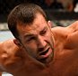 NEWARK, NJ - APRIL 18:  Luke Rockhold punches Lyoto Machida of Brazil in their middleweight bout during the UFC Fight Night event at Prudential Center on April 18, 2015 in Newark, New Jersey.  (Photo by Josh Hedges/Zuffa LLC/Zuffa LLC via Getty Images)