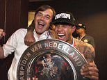 epa04711254 Coach Phillip Cocu (L) and player Memphis Depay (R) of PSV Eindhoven celebrate with the Championship trophy in the dressing room, after winning the Dutch Eredivisie soccer league in the Philips Stadium, Eindhoven, Netherlands, 18 April 2015.  EPA/OLAF KRAAK