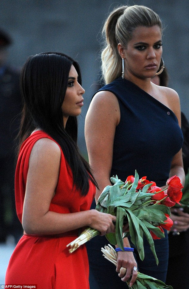 Kim and her sister Khloe prepare to lay flowers at Armenia's genocide memorial during their trip earlier this month. Their ancestors are from their father's side 