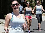 Kelly Brook showing curves with shorter friend while hiking.  April 26, 2015 X17online.com