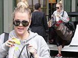 Khloe Kardashian visits sister Kendall Jenner after an early morning workout session in Beverly Hills.  May 12, 2015 X17online.com