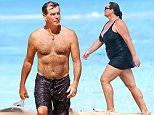 EXCLUSIVE: ** PREMIUM RATES APPLY** A shirtless Pierce Brosnan stays in shape by running the beach and then snorkeling while in Hawaii.\n\nPictured: Pierce Brosnan\nRef: SPL1020643  140515   EXCLUSIVE\nPicture by: Splash News\n\nSplash News and Pictures\nLos Angeles: 310-821-2666\nNew York: 212-619-2666\nLondon: 870-934-2666\nphotodesk@splashnews.com\n