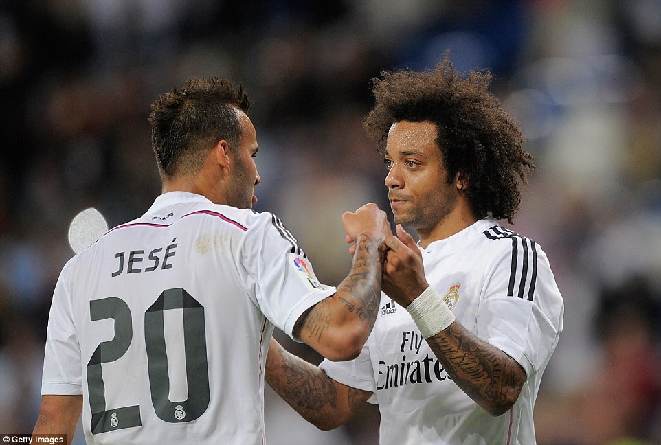 Jese Rodriguez and Marcelo - Real's last two goalscorers of the game - celebrate together after the latter netted with the game's last touch