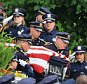 Police officers carry the casket of Omaha Police Officer Kerrie Orozco out of St. John's Catholic Church on the campus of Creighton University following funeral services in Omaha, Neb., Tuesday, May 26, 2015. Orozco was shot to death on May 20 while trying to arrest a fugitive who was in turn fatally shot by another officer. (AP Photo/Nati Harnik)