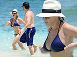 EXCLUSIVE: **PREMIUM RATES APPLY**  Comedians Chelsea Handler and Josh Wolf cool off in the ocean in Bahamas. Chelsea Handler wearing a tiny blue bikini with white fedora hat went for a swim with her opening act friend Josh Wolf. The comedians were at the Atlantis, Paradise Island Memorial Day Weekend for Chelsea's new stand up act Uganda Be Kidding Me. Comedian Josh Wolf opened the show for the former late night host Chelsea Handler. Chelsea took the stage in Atlantis Ballroom wearing casual black shirt and pink jeans.
Pics taken May 23rd.

Pictured: Chelsea Handler and Josh Wolf
Ref: SPL1033602  260515   EXCLUSIVE
Picture by: Jason Winslow / Splash News

Splash News and Pictures
Los Angeles: 310-821-2666
New York: 212-619-2666
London: 870-934-2666
photodesk@splashnews.com