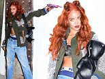 EXCLUSIVE: Rihanna was spotted visiting the un-opened Gallery of Artisit , Mr. Brainwash, in NYC. They posed together with some of the pieces, and then Rihanna took time to pose alone with a prop gun making mean faces. One of the featured works was a giant painting of Basquiat. Rihanna pretended to shoot Brainwash in the head with her gun, as well as their photographer. She wore only a bra under her small jacket.