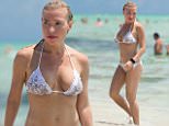 Fitness guru Tracy Anderson shows off her bikini body on the beach in Miami. Tracy enjoyed a vacation in the sunshine state with a group of friends and was spotted playing in the surf with her daughter Penelope.\n\nRef: SPL1047928  080615  \nPicture by: Splash News\n\nSplash News and Pictures\nLos Angeles: 310-821-2666\nNew York: 212-619-2666\nLondon: 870-934-2666\nphotodesk@splashnews.com\n
