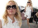 Picture Shows: Pamela Anderson  June 12, 2015\n \n Actress Pamela Anderson departing on a flight at LAX airport in Los Angeles, California. Pamela was kind enough to stop and sign a couple of autographs before heading inside.\n \n Non-Exclusive\n UK RIGHTS ONLY\n \n Pictures by : FameFlynet UK © 2015\n Tel : +44 (0)20 3551 5049\n Email : info@fameflynet.uk.com