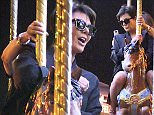 EXCLUSIVE ALL ROUNDER ***SPECIAL FEES APPLY*** Kris Jenner goes on a merry-go-round with designer Olivier Rousteing at the Eiffel Tower in Paris, 11 June 2015.\n12 June 2015.\nPlease byline: Vantagenews.co.uk