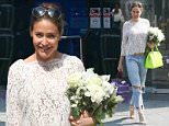 Picture Shows: Lisa Snowdon  June 12, 2015: June 12, 2015\n \n Radio presenter Lisa Snowdon was all smiles as she left Capital Radio studios with a huge bouquet of flowers in London, England.\n \n Lisa's flowers were conveniently co-ordinated with her sheer white lace top which she paired with a distressed blue jeans and a pair of strappy heels.\n \n Non Exclusive\n WORLDWIDE RIGHTS\n \n Pictures by : FameFlynet UK © 2015\n Tel : +44 (0)20 3551 5049\n Email : info@fameflynet.uk.com