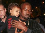 Mandatory Credit: Photo by LAURENTVU/SIPA/REX Shutterstock (4116187e).. Kanye West with daughter North West.. Balenciaga show, Spring Summer 2015, Paris Fashion Week, France - 24 Sep 2014.. ..