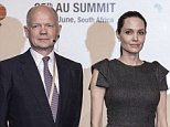 Former British first Secretary of State William Hague, United States actress and UNHCR representative Angelina Jolie (C) and African Union Commission chairperson Nkosasana Dlamini-Zuma pose for a picture ahead of a panel on Conflict related gender violence on June 12, 2015 during a session of the African Union Summit in Johannesburg, South Africa.  AFP PHOTO / GIANLUIGI GUERCIAGIANLUIGI GUERCIA/AFP/Getty Images