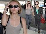 15 June 2015.
Vanessa Paradis and Lily Rose Melody Depp  pictured at Los Angeles International Airport
Credit: GoffPhotos.com   Ref: KGC-30/150615NR3