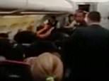 Pic shows: Moment blonde woman shouting in English with a strong Russian accent: "I am mother of seven children and Vladimir Putin will kill you."
This inebriated woman was removed from a Moscow-bound flight in Paris after screaming in English at security guards attempting to calm her down that President Vladimir Putin would kill them.
A video of the incident filmed by another passenger showed a blonde woman gesticulating wildly and shouting in English with a strong Russian accent: "I am mother of seven children and Vladimir Putin will kill you."
Then she repeats that she is the mother of seven children and breaks down into tears while a man shouts in the background: "Go on then."
French security officers had attempted to apprehend the woman, not named but who was apparently 40 years old, after she refused to calm down at which point she started shouting her abuse.
According to fellow passengers, the woman had been drinking copious amounts of vodka in the business lounge ahead of the