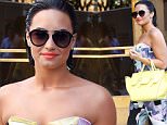 Demi Lovato wears colorful print onesie dress while greeting fans outside Z100 studios in New York City.\n\nPictured: Demi Lovato\nRef: SPL1062366  250615  \nPicture by: Splash News\n\nSplash News and Pictures\nLos Angeles: 310-821-2666\nNew York: 212-619-2666\nLondon: 870-934-2666\nphotodesk@splashnews.com\n