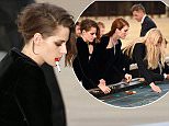 Mandatory Credit: Photo by REX Shutterstock (4897629i)
 Kristen Stewart playing roulette on the catwalk
 Chanel show, Autumn Winter 2015, Haute Couture, Paris Fashion Week, France - 07 Jul 2015