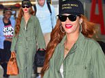 Rihanna was spotted arriving to NYC on Monday afternoon. She had big smiles on her face as she walked through the terminal of JFK Airport. She carried her own luggage, and her New puppy , "Pepe" in a dog carrier. Her BFF Melissa Forde accompanied her on the flight, as well as her very tall Bodyguard. She wore a green jumpsuit, ray bans and a Black baseball cap.\n\nPictured: Rihanna\nRef: SPL1072279  060715  \nPicture by: 247PAPS.TV / Splash News\n\nSplash News and Pictures\nLos Angeles: 310-821-2666\nNew York: 212-619-2666\nLondon: 870-934-2666\nphotodesk@splashnews.com\n