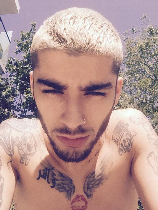 Chilling: Zayn Malik posted a carefree selfie on Twitter on Tuesday afternoon which saw the star lounging in the sunshine