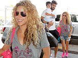 © LOOK PRESS AGENCY\nCODE: QUIMI-ZOOM\n*******EXCLUSIVE*******\nBarcelona airport, 3 July 2015\nSHAKIRA AND PIQUE DEPART ON HOLIDAYS WITH THEIR CHILDREN.\nColombian star singer Shakira and footballer Gerard Pique departed on holidays in a private jet.\nThe couple arrived in the airport with their kids Milan and Sasha, accompanied by two nannies, and two male assistants for the luggage and cars.