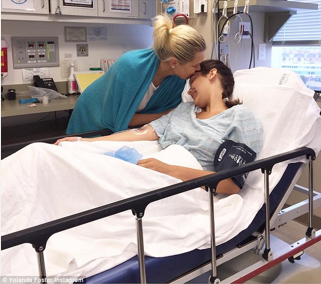 A mother's touch: Yolanda Foster kissed Bella Hadid before she got her tonsils removed on Tuesday