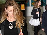 EXCLUSIVE: Amber Heard returns to Australia after claiming she would "avoid the land Down Under from now on, just as much as we can".\nAmber looked sheepish and bowed her head as she arrived in Brisbane. She will be joining husband Johnny Depp on the Gold Coast, where he is currently filming 'Pirates of the Caribbean: Dead Men Tell No Tales'.\nShe hit out at Australia last month after she and Depp were forced to fly their dogs back to America earlier this year or risk them being euthanized, because the pets flew in on a private jet without documentation.\n\nPictured: Amber Heard\nRef: SPL1060546  090715   EXCLUSIVE\nPicture by: Splash News\n\nSplash News and Pictures\nLos Angeles: 310-821-2666\nNew York: 212-619-2666\nLondon: 870-934-2666\nphotodesk@splashnews.com\n