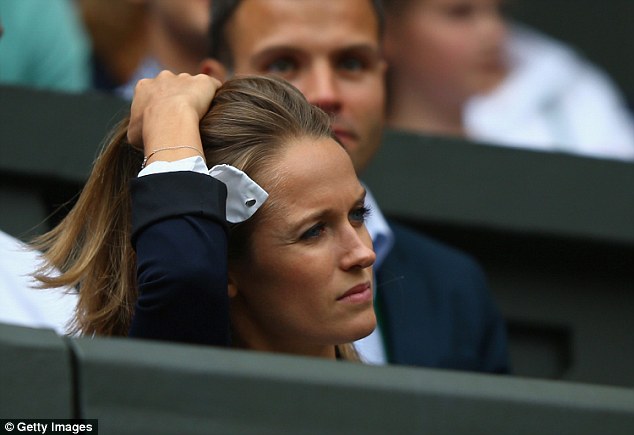 The tennis wag pulls her famous locks off her face showing the strain ahead of Andy's crucial match