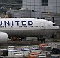 SAN FRANCISCO, CA - JULY 08:  United Airlines planes sit on the tarmac at San Francisco International Airport on July 8, 2015 in San Francisco, California. Thousands of United Airlines passengers around the world were grounded Wednesday due to a computer glitch. An estimated 3,500 were affected.  (Photo by Justin Sullivan/Getty Images)