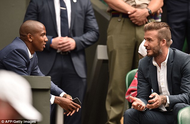 Footie friends: David was seen talking to Manchester United and England footballer Ashley Young