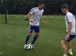 Terry prepares to take on Cahill in a training dribbling drill